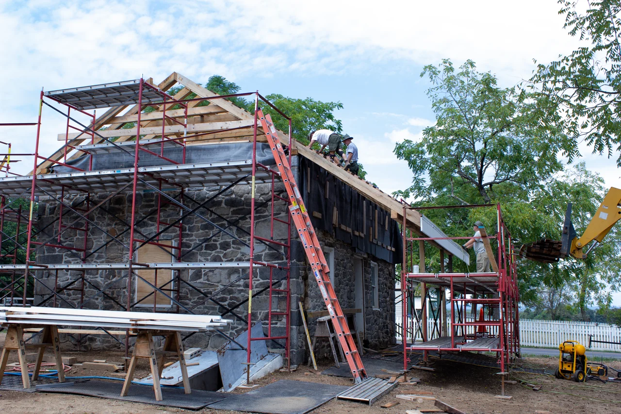 Scaffolded roof with exposed framing